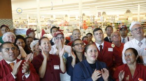 Market Basket employees clap and cheer while watching a televised speech by restored Market Basket CEO Arthur T. Demoulas, at a supermarket location, in Chelsea, Mass. (AP Photo/Steven Senne)