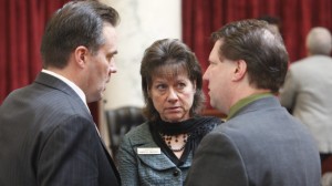Sen. Sheryl Nuxoll, R-Cottonwood, center, talks with Senators Russell Fulcher, R-Meridian, left, and Clifford Bayer, R-Ada, while the Senate is at ease, following Nuxoll's motion to begin the amendment process, Thursday, Feb. 21, 2013 in Boise, Idaho. Idaho senators voted Thursday to back the governor's plan to create a state-based nonprofit insurance exchange, rather than defaulting to an exchange run by the federal government, as many other Republican-led states have done. Credit: AP Photo/The Idaho Statesman, Katherine Jones