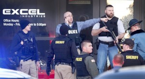 Police guard the front door of Excel Industries in Hesston, Kan., after a mass shooting. Credit: Fernando Salazar/Associated Press