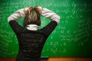 woman in front of a blackboard